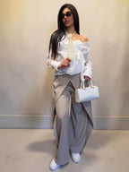 Pantalone palazzo gessato con pattina frontale
