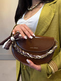 Borsa rigida a mezza luna con fiocco