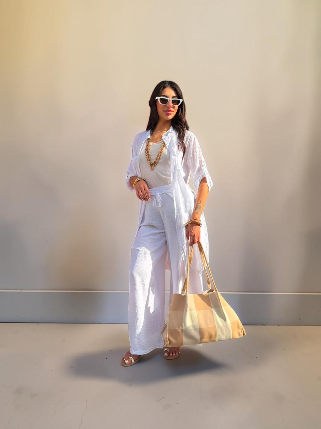Pantalone palazzo con piegone avanti